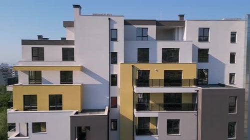 Aerial Drone Shot Orbiting a Modern Residential Building with Clean Architecture Large Windows and
