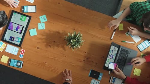 Team Brainstorming App Designs at Modern Office Workplace