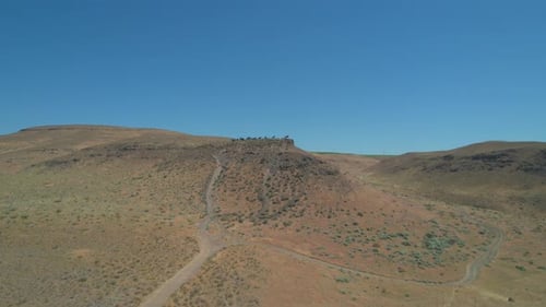 Rising up and to drone view of Wild Horses Monument at Columbia River Gorge, Central Washington