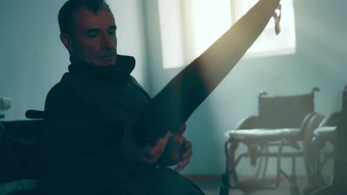 A Disabled Man Assembles a Stroller