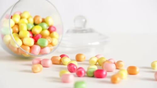 Food, Confectionery and Sweets Eating Concept - Close Up of Scattered Candy