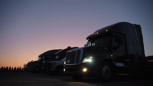 Freight Trucks Parked at Sunrise