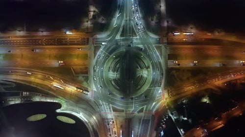 Hyperlapse Timelapse of Car Traffic Transport at Roundabout in Foggy Night