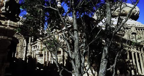 Majestic Ancient Architecture Surrounded By Lush Greenery Under Clear Sky