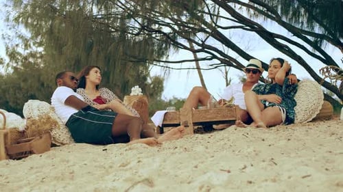 Two Couples Sitting at a Picnic Area Quietly and Happily on The