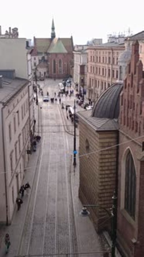 Cityscape Aerial View with People Walking Along Street