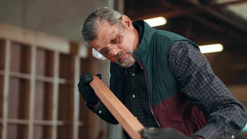 Carpentry, woodwork and man in factory for sanding wood for furniture, manufacturing