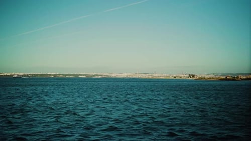Nature Shore Lake Waves Wind Sunny Daylight Ferry Boat Boat Ship Passing Steady Shot 4K