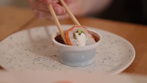 Delicious sushi with fresh ingredients and spicy sauce at home