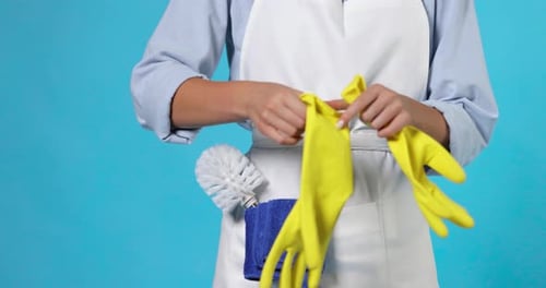 Cleaner Woman in Apron Wearing Yellow Rubber Gloves