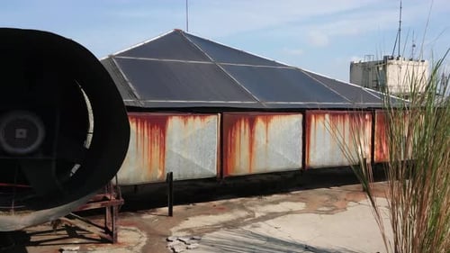 Rooftop of industrial building with heating ventilating and air conditioning units. Industrial exhau