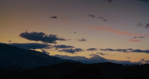 Sunset Cloudscape Timelapse on Mountain Landscape Clouds on Orange Sky