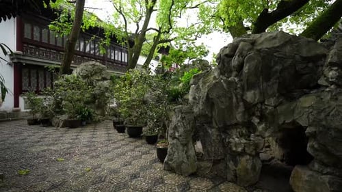 Woman taking pictures at Yuyuan Garden, Shanghai