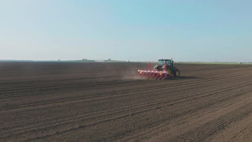 Large view on the tractor harrowing