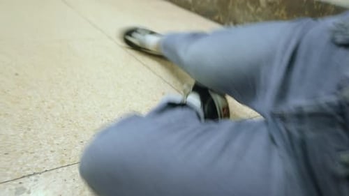 Person Wearing Jeans and Shoes Lying on Floor