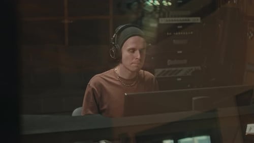 Music Producer Recording New Track at Sound Studio