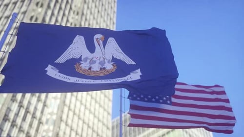Waving Louisiana State and US National Flags