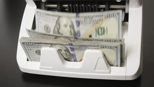 Money Counting Process Paper Money in Counting Machine Business and Finance Concept with Money UDS
