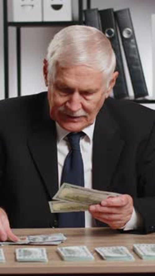 Rich Caucasian Senior Businessman Counting Money Cash Calculate Earnings Income Profit at Home
