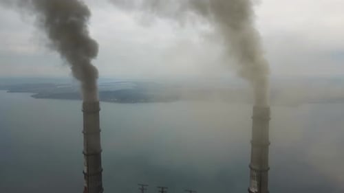 Aerial View of Coal Power Plant High Pipes with Black Smoke Moving Up Polluting Atmosphere