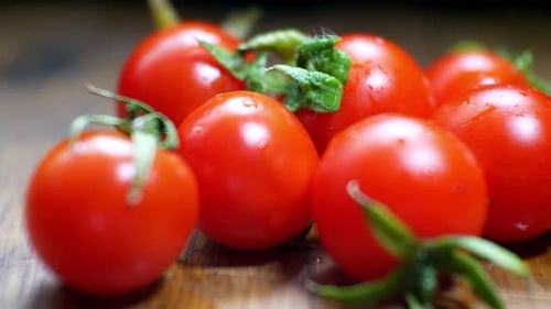 Fresh Cherry Tomatoes on Wooden Board Close Up