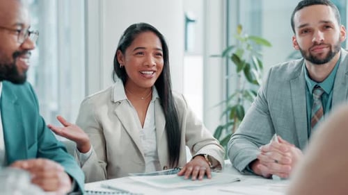 Diverse Business Team Collaborates and Celebrates in Workplace