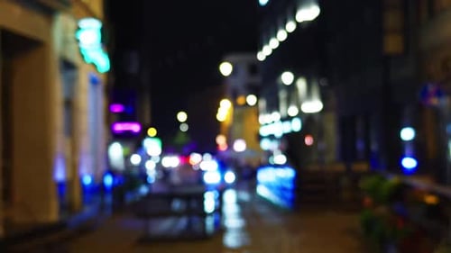 A Vibrant and Lively Night Street Scene Showcasing Colorful Neon Lights Illuminating the City