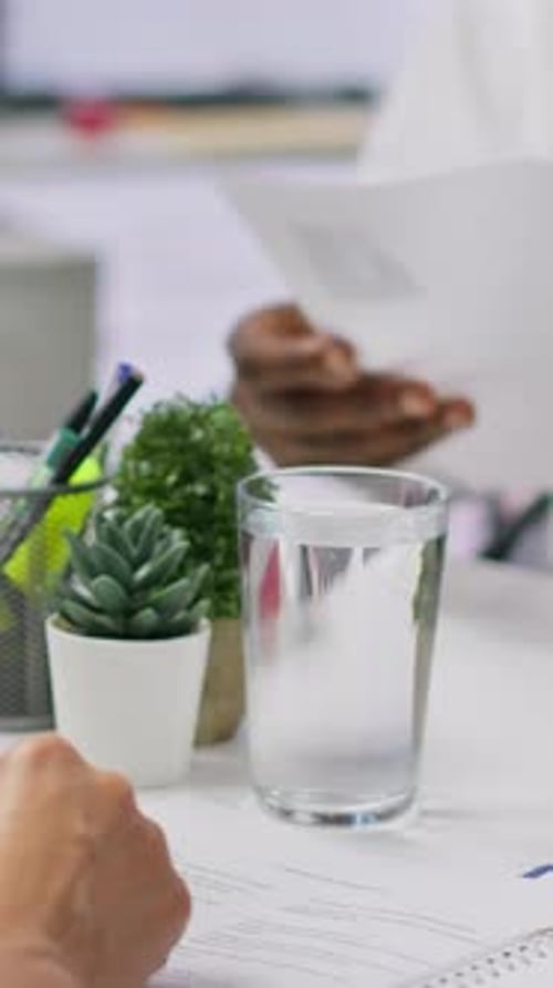 Vertical Video Job Candidate Hands Over His CV to Team of HR Professionals to Start Interview