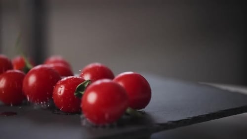 Slow Motion View of Fresh Cherry Tomatoes Falling Down Presentation of Organic Vegetables with Water
