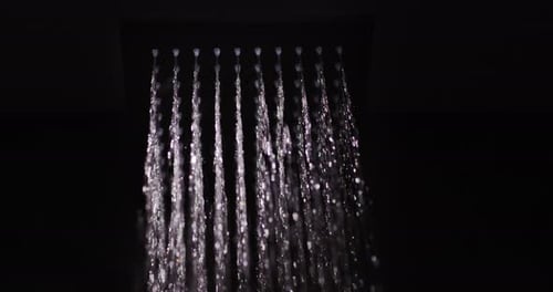 Water Flows From a Black Square Nozzle in the Shower