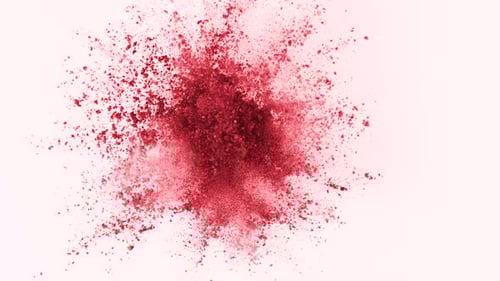 Vibrant Red Powder Exploding on a White Background