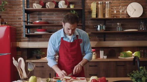 Young Man Preparing Food in Cozy Kitchen