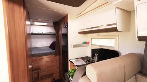 RV Interior with Bed and Kitchenette