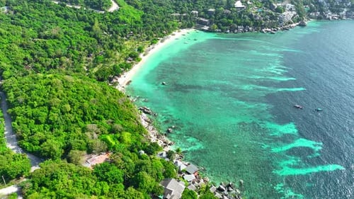 Sandy beach coastline in a tropical island in Thailand from aerial view.