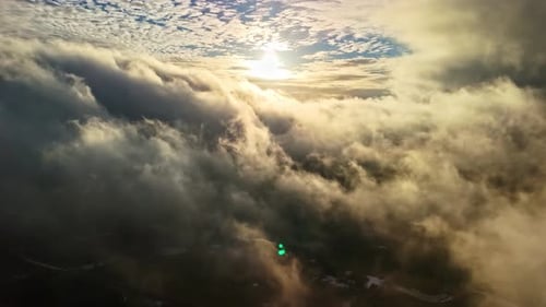Clouds and sun in the sky.