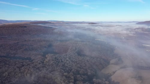 Aerial View of Frosty Landscape in a Bright Misty Morning