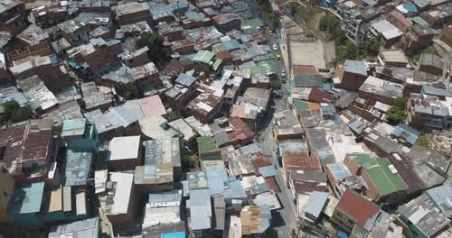 Drone aerial flying low over comuna 13 slums famous area in Medellin, Colombia