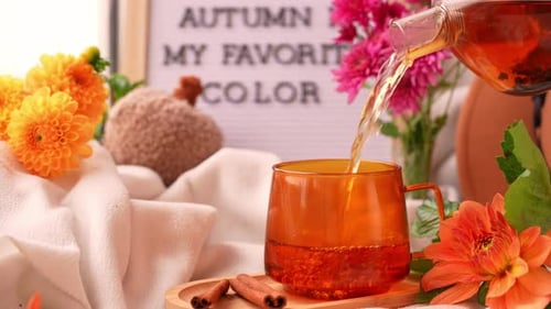 Tea Pouring Into Orange Cup with Letter Board Saying AUTUMN IS MY FAVORITE COLOR Autumn Fall Bouquet