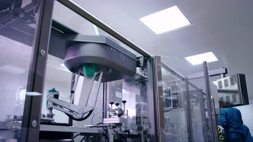 Automated pharmaceutical production line packing machine at modern pharmaceutical plant