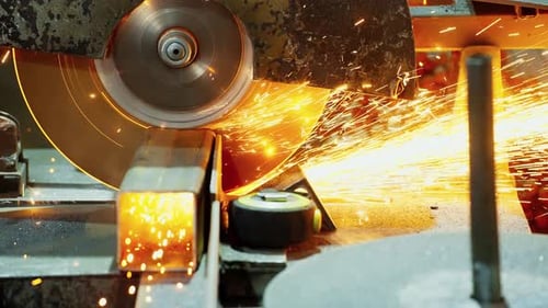 Worker Using an Angle Grinder Producing a Lot of Sparks