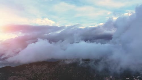 Majestic Mountains and Clouds at Sunrise Aerial View