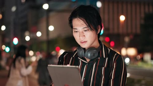 City, face and tablet with businessman at night for problem solving, research or thinking