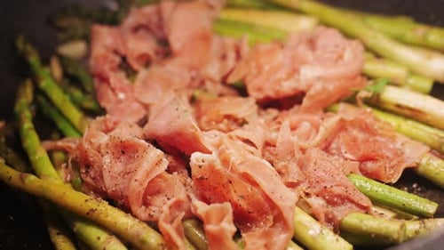 Grilled Green Asparagus with Jamon Pork Bacon Beef Cast Iron Plate Chef Cooking Spanish Traditional
