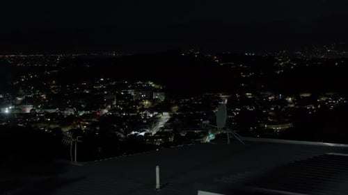 Wide shot of empty nighttime cityscape in Wellington, New Zealand