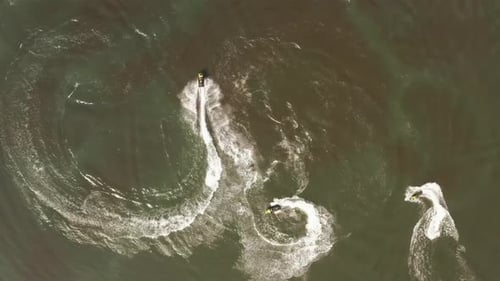 Jetski roaring across the open waters of The Mediterranean Sea, Aerial follow footage