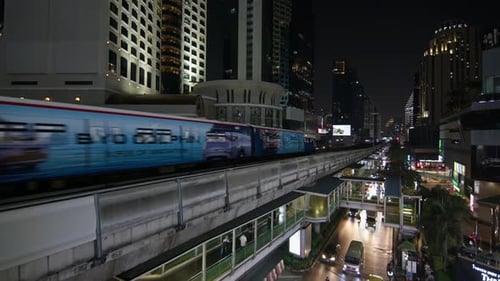 Nighttime Train Travel in Bangkok, Thailand: Exploring the City Under City Lights
