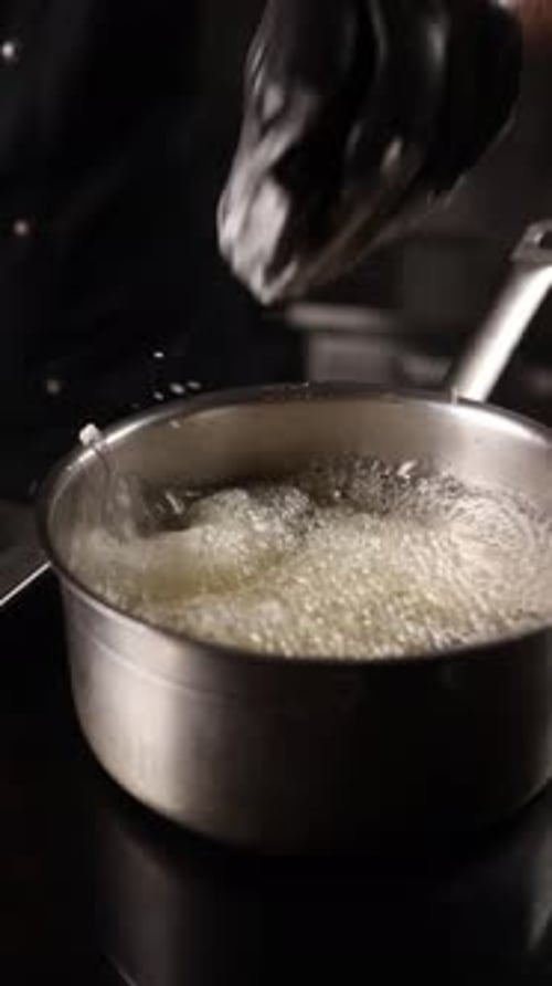 Chef cooking meat in a restaurant