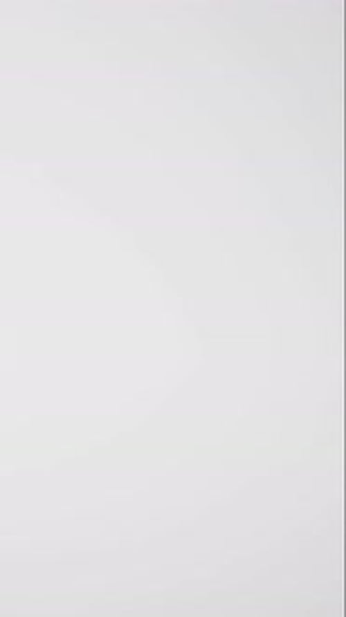 Vertical video of hourglass with sand pouring, copy space on white background