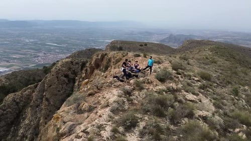 Hikers group walk along a rout in the mountain.