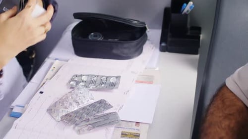 Doctor Measures Blood Pressure of Senior Patient in Office